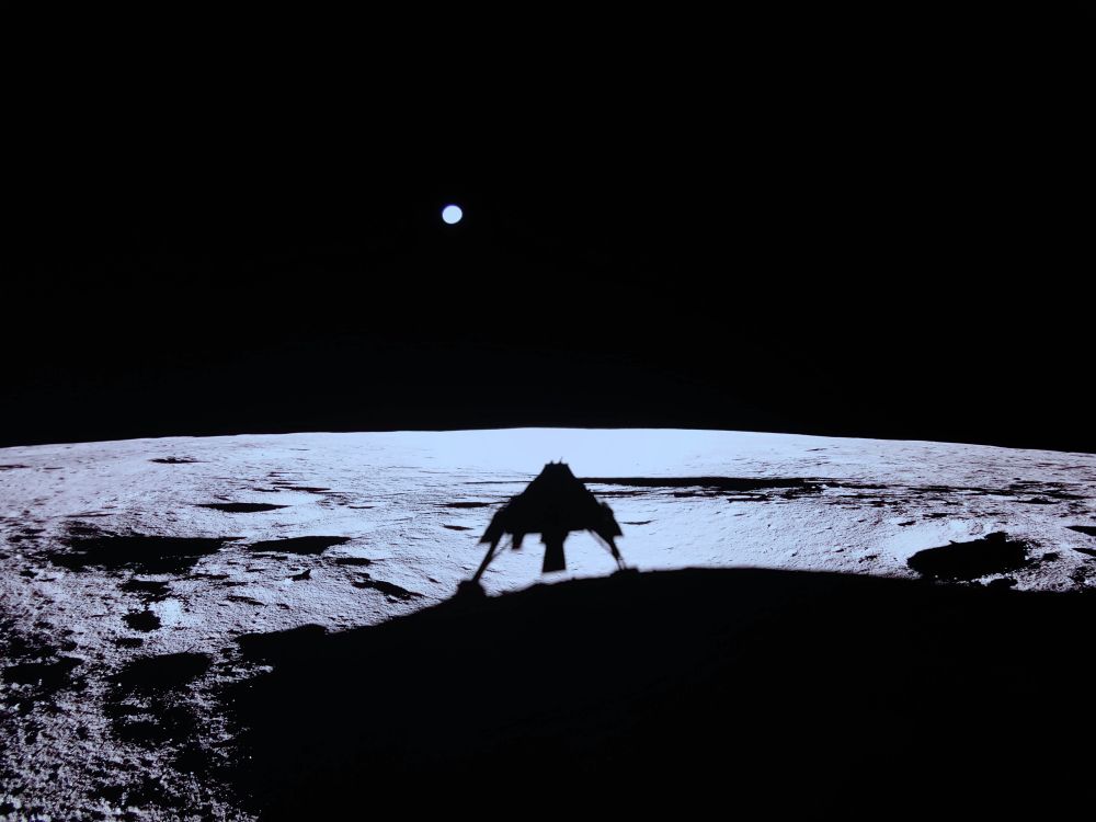 Photo from Firefly Aerospace Blue Ghost Lander showing the lander’s shadow on the lunar surface in the bottom half of the image, and a distant Earth against the blackness of space in the upper half of the image

Credit: Firefly Aerospace