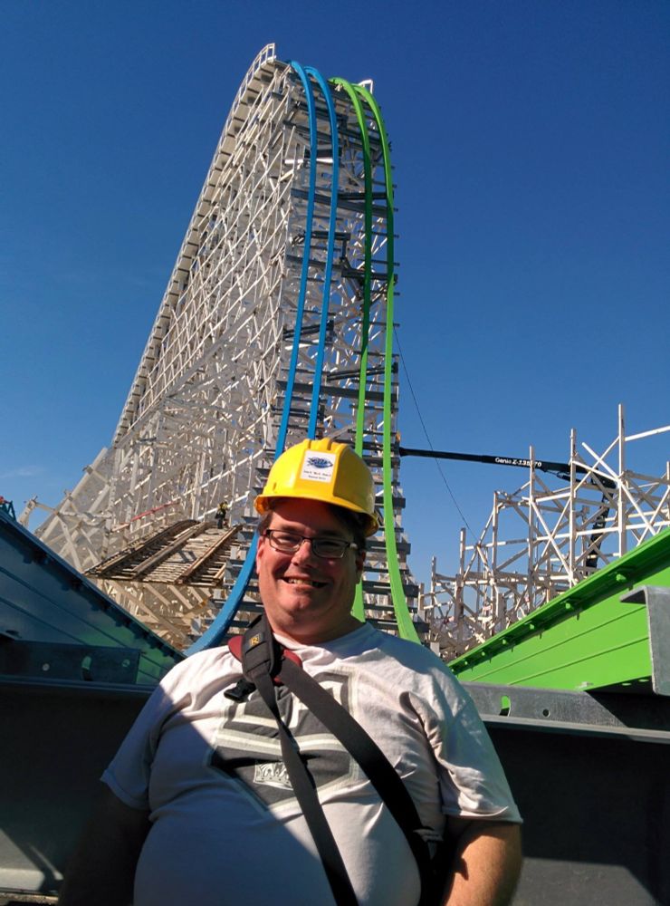Me, in a hardhat in between the track of Twisted Colossus, while it was under construction.