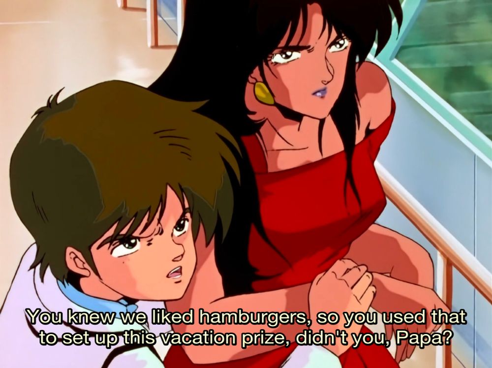 Screenshot of Dirty Pair episode 7. Clicky Goldjeff, the fiancee of Joanca who is later in this scene revealed to be a trans woman, is saying "You knew we liked hamburgers, so you used that to set up this vacation prize, didn't you, Papa?"