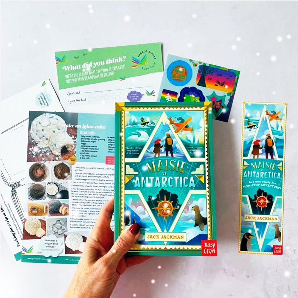 A book - Maisie vs Antarctica - with a bookmark and instructions to make an igloo cake. 