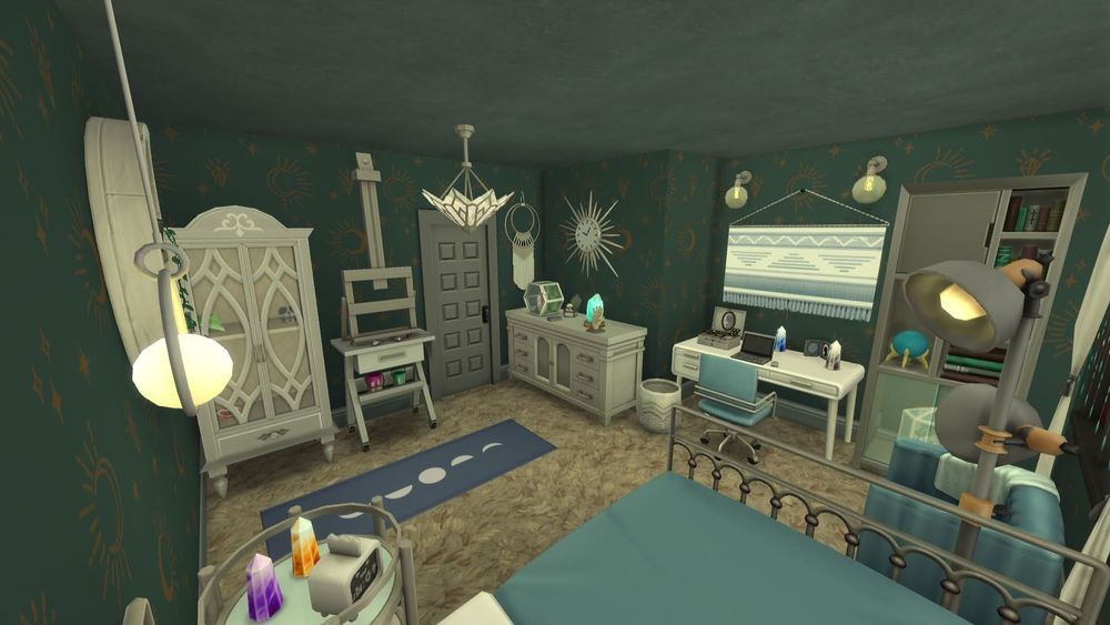 View from the back corner of the blue and crystal themed bedroom I designed for a teenager or adult in the house. Plush beige carpet with celestial blue walls. There is a desk around the corner next to the dresser. A bookcase is next to the desk. There is a blue chair at the desk with a laptop and jewelry box with a blue and white tapestry on the wall. From this view the dresser is visible next to the door with a sunburst clock above it. The crystal display, mirrored bed side table, and desk all have crafted crystals on them.
