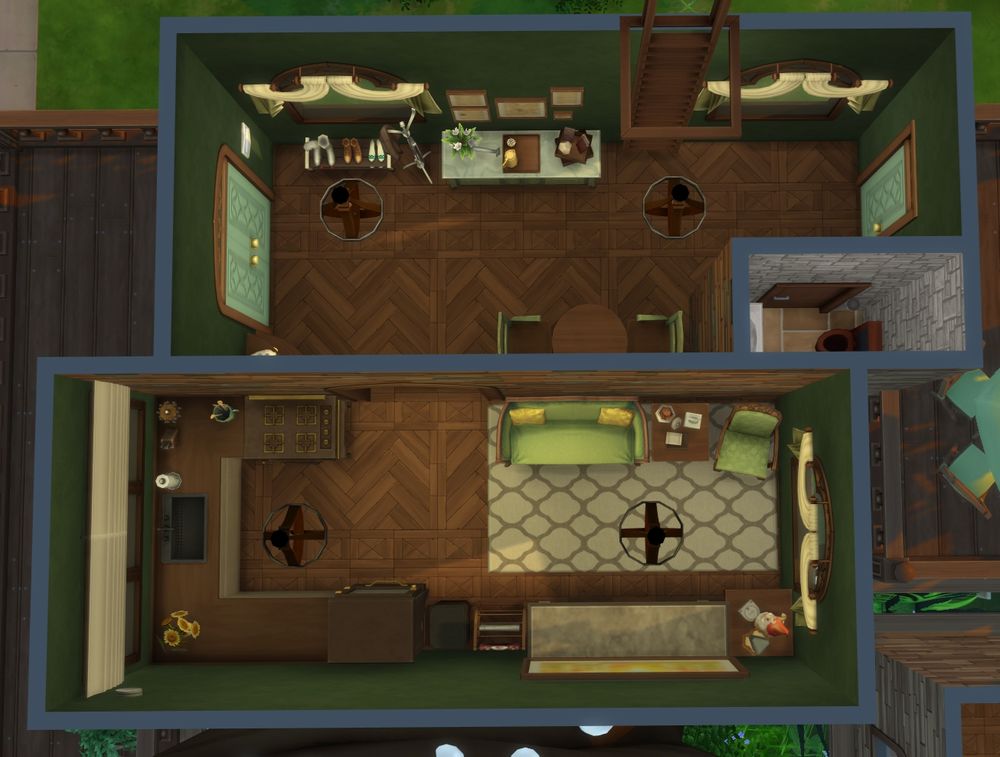 The first floor of the main house. The entry room has a 2 seat dining table and a half bathroom attached. The kitchen and living area are in the next room. The house has a green and brown theme.