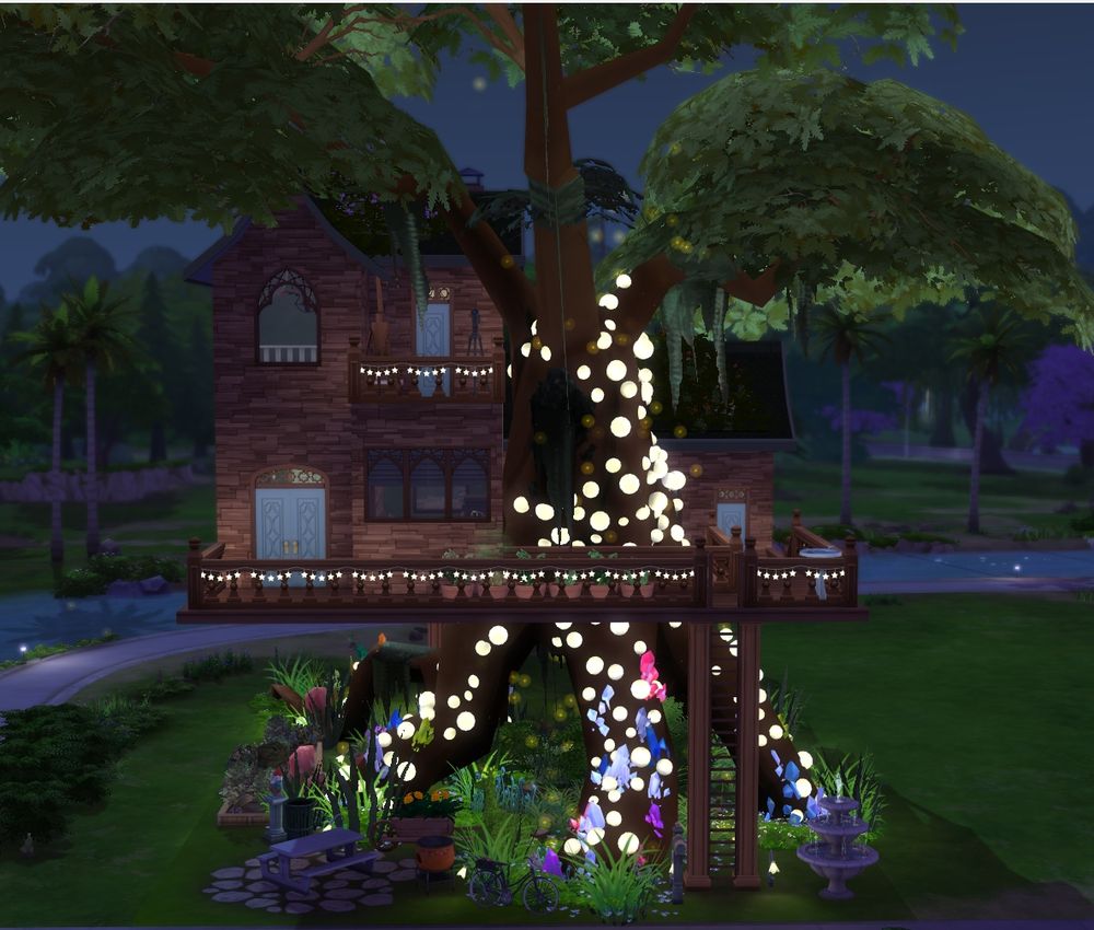 The nighttime view of the treehouse. The lights and crystals are lit and the tree trunk is surrounded by small fireflies.