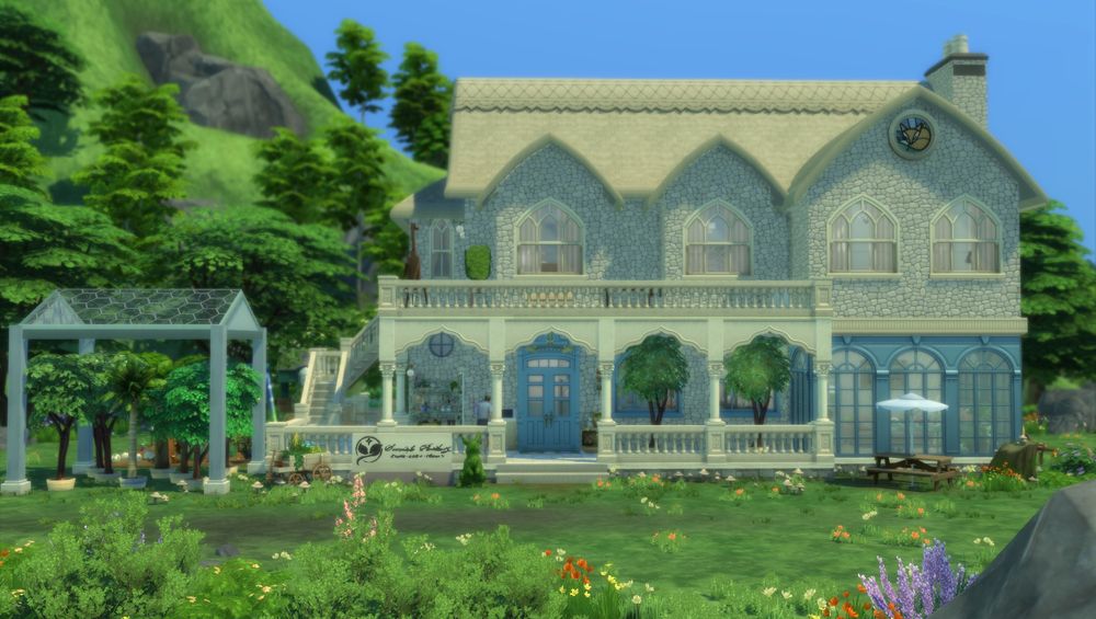 The front of the garden center with a garden on the left.