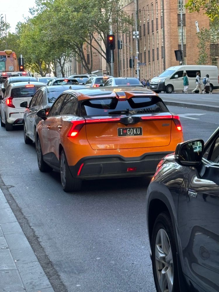 Orange car with custom number plate I ❤️ GOKU