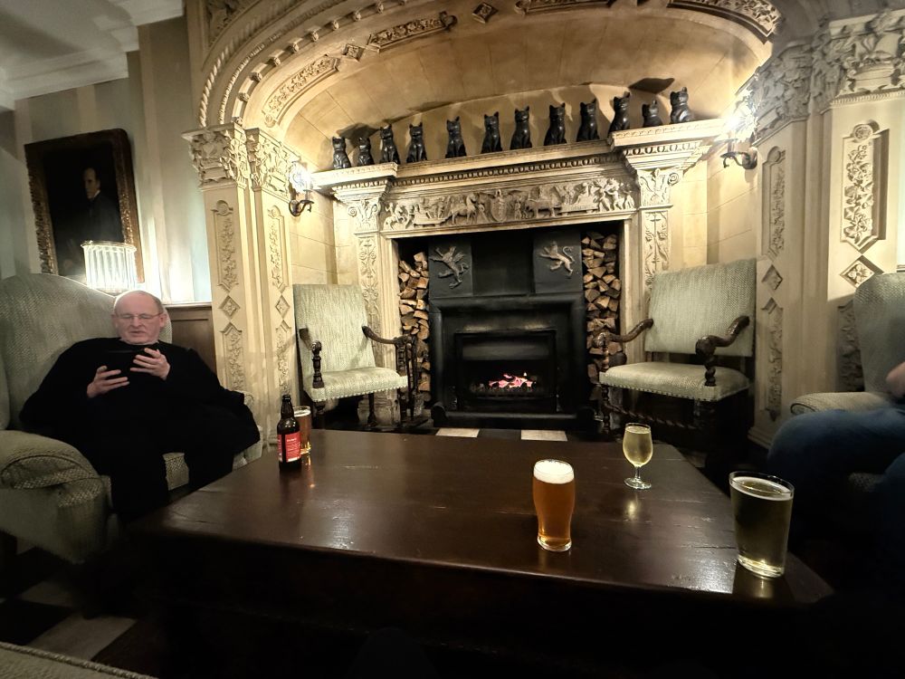 In the Portmerion hotel by the fire with beer.