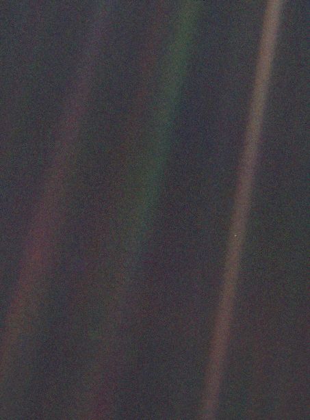 The Voyager 1 ‘Pale Blue Dot’ photo, taken because Carl Sagan proposed flipping the spacecraft around just beyond Saturn to take one last photo of Earth as an inspirational perspective on our place in the universe.  

Earth is the pale blue dot about 3/5 of the way down the bar on the right.