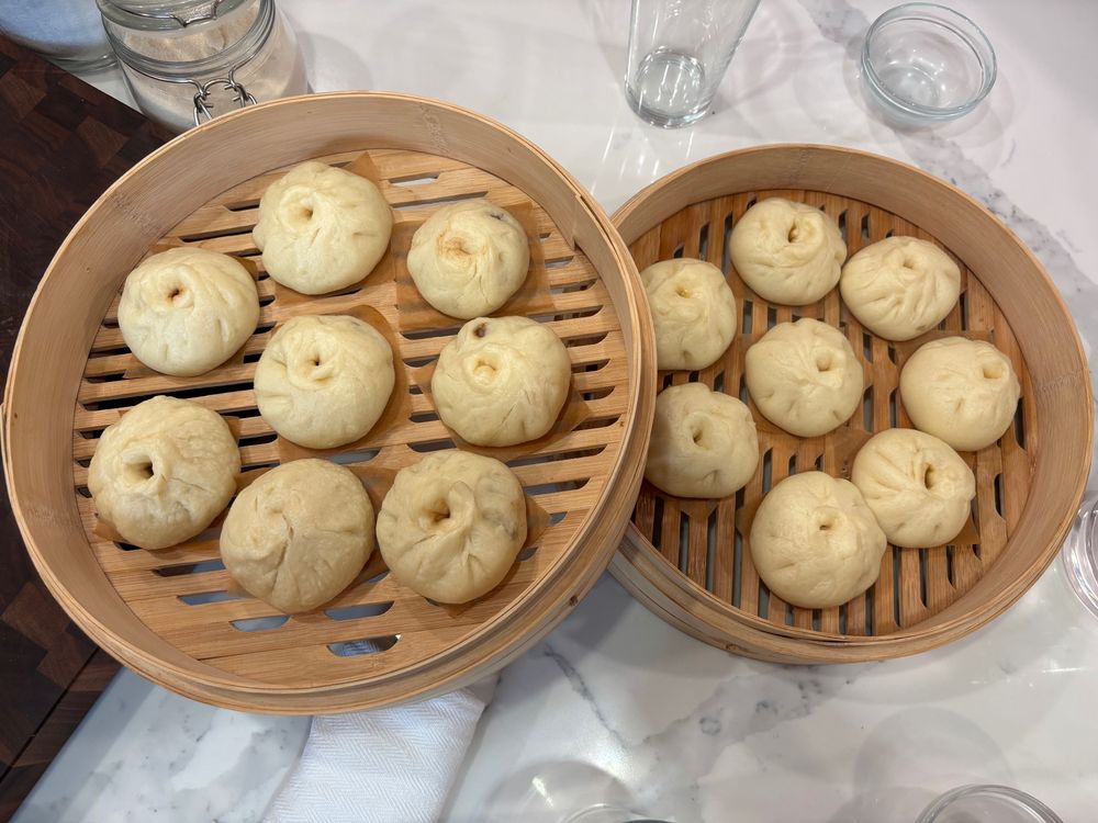 Home made steamed bao with pickled lime and cabbage or pork filling