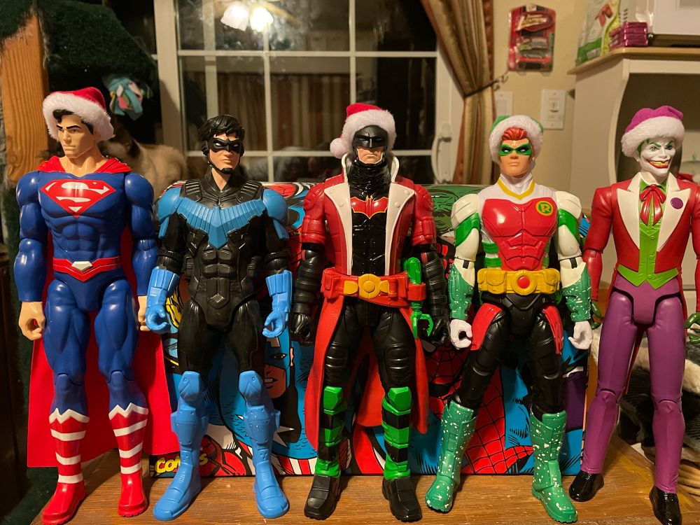 DC Comics action figures of Superman, Nightwing, Batman, Robin and Joker 