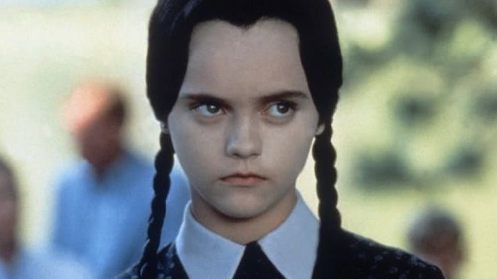 Wednesday Addams, a young dark haired girl with a neutral expression.

Pictured here by Christina Ricci