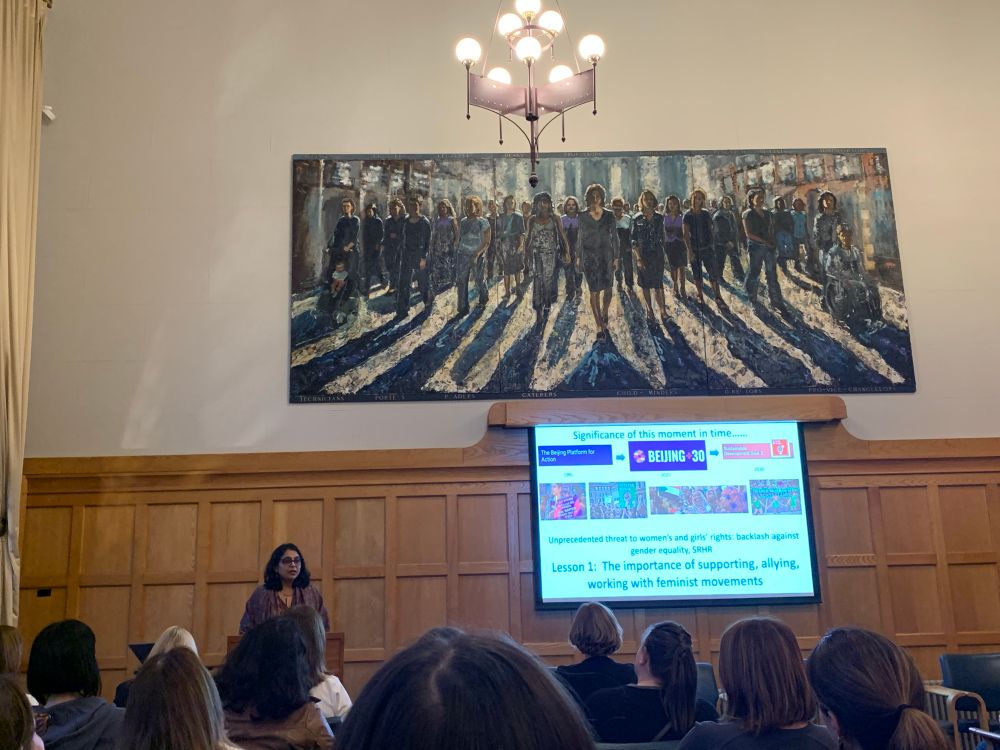 Avni Amin with slide show in queens university. 