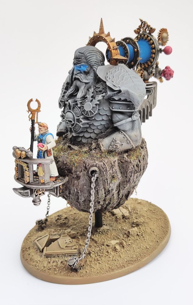 A heavily converted and partially scratch built Warhammer model of a floating island with a large statue on top