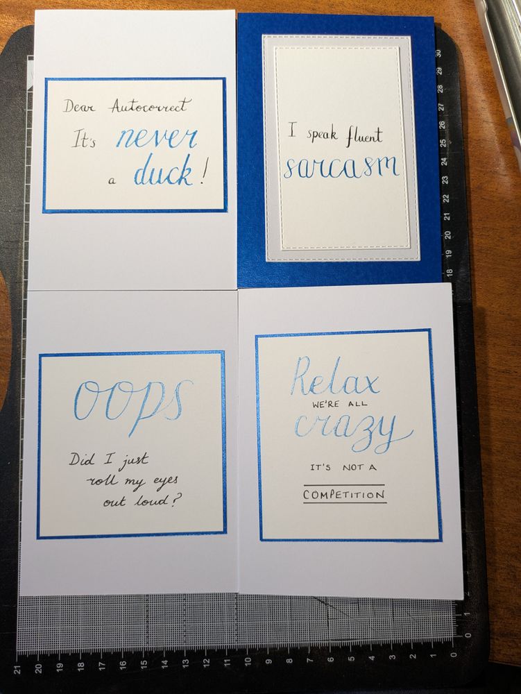 Four handlettered cards in a blue theme. 
The fronts say:
Dear Autocorrect, it's never a duck.
I speak fluent sarcasm.
Oops, did I just roll my eyes out loud?
Relax we're all crazy, it's not a competition. 