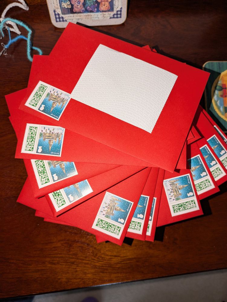 A stack of red envelopes with second class stamps on them.
What can't be seen is they all contain handmade cards. 