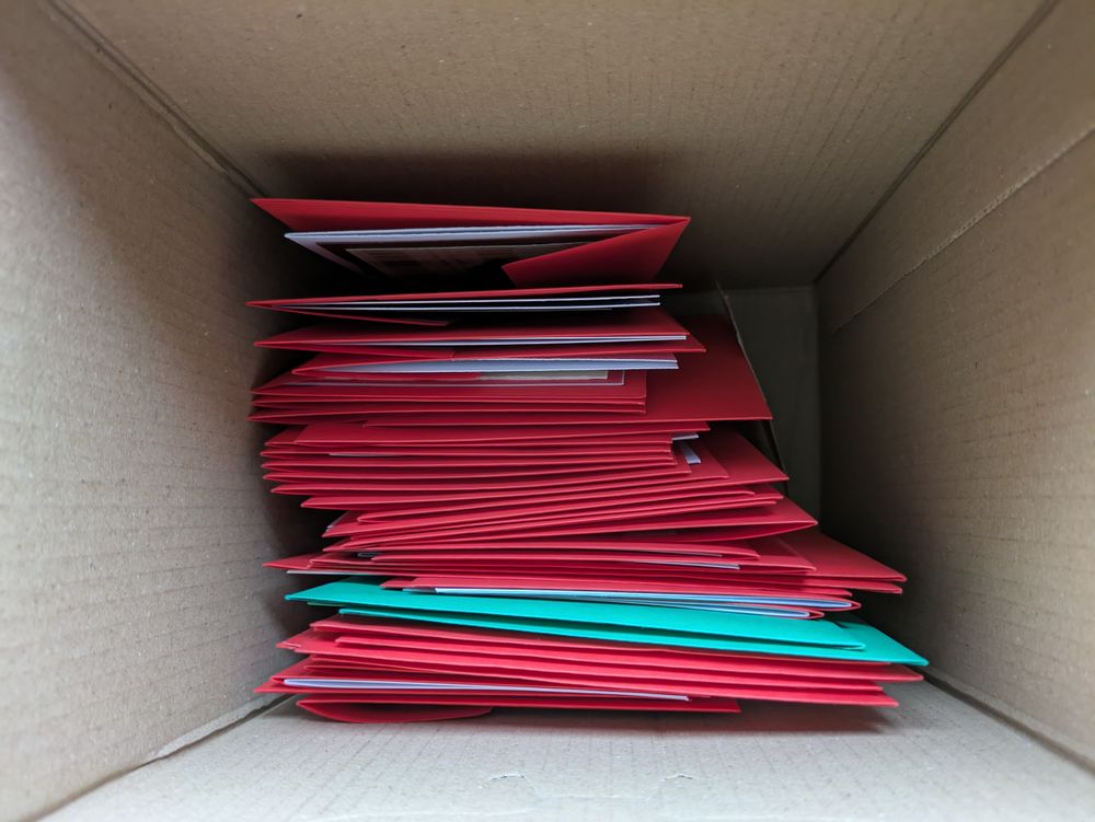 A box of red (and a few green) envelopes. It's not obvious but each envelope contains a handmade card. 