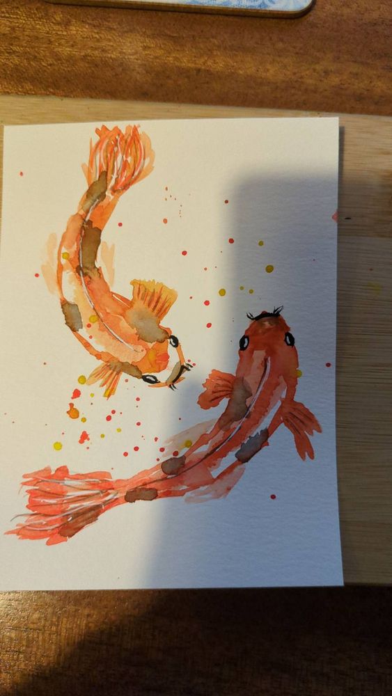 A water colour painting of what could be two koi carp or two goldfish.
