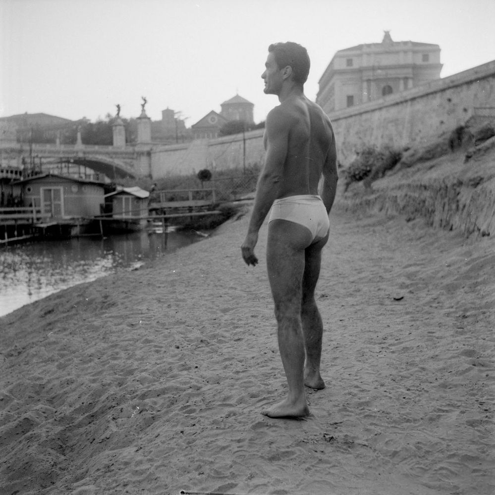 Pier Paolo Pasolini in a speedo on the beach