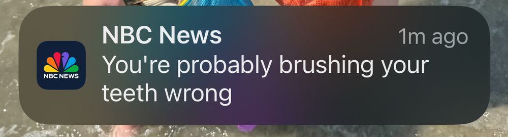 Phone notification from NBC News: "You're probably brushing your teeth wrong."