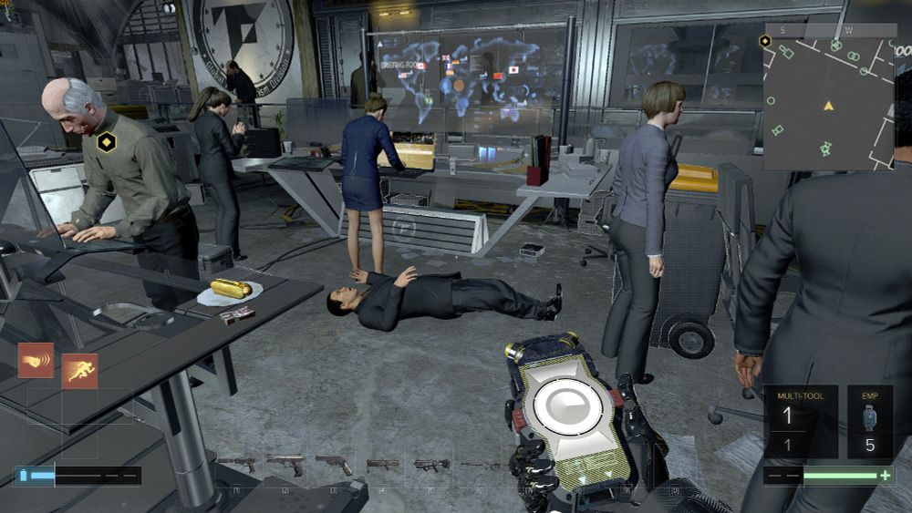 Gameplay screenshot of Deus Ex Mankind Divided. The player is staring at an unconscious body while the coworkers fail to react to the body that the player dragged in.