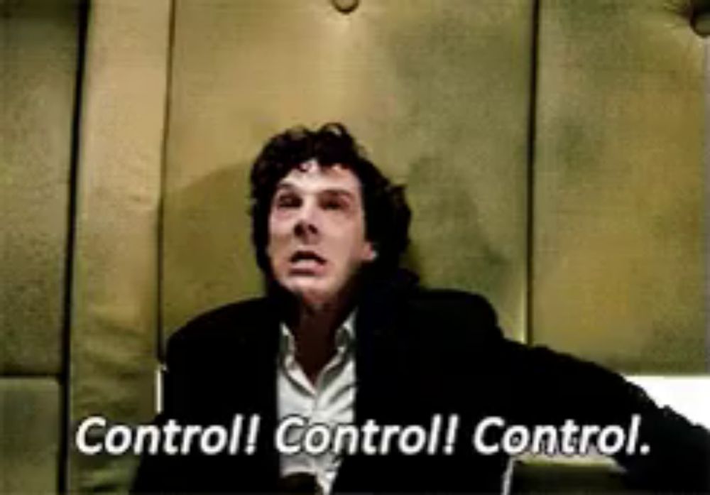 a man in a suit is sitting in a chair with the words `` control ! control ! control . ''