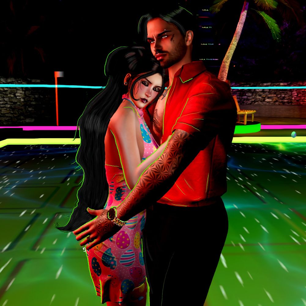 An edit of a man and woman slow dancing together on a colorful dance floor.