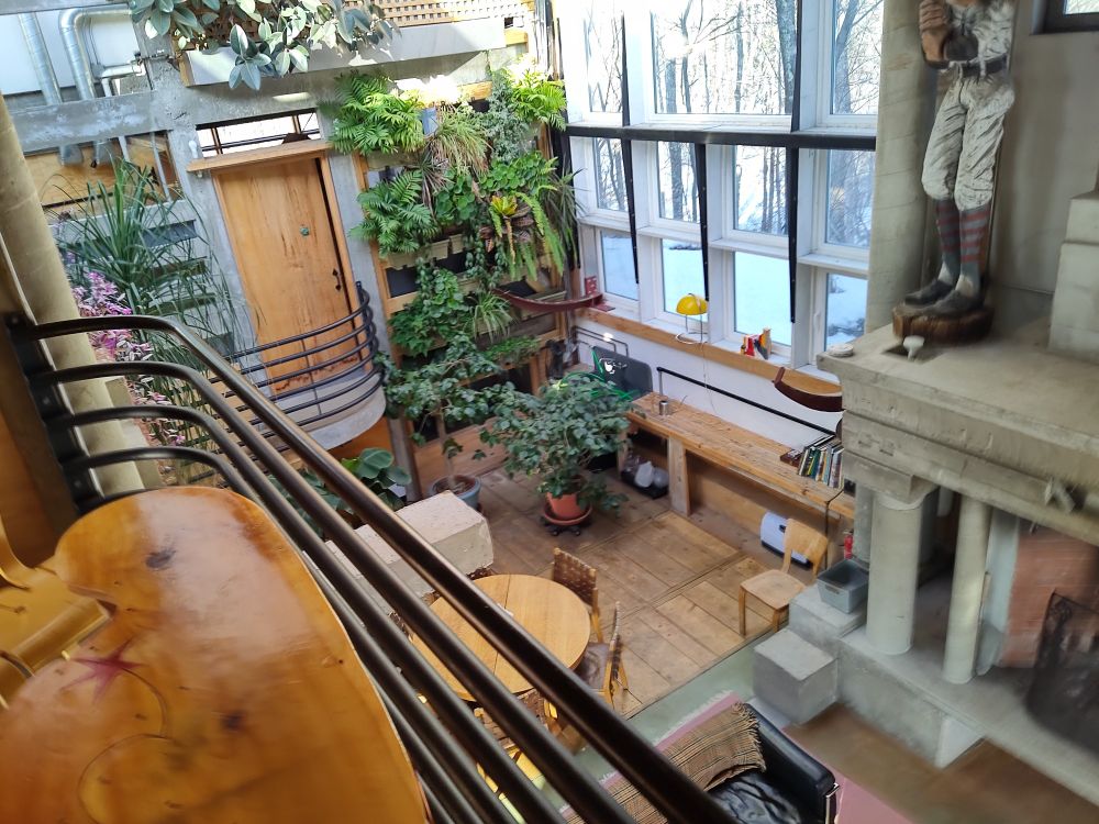 brutalist house with wood and concrete and plants