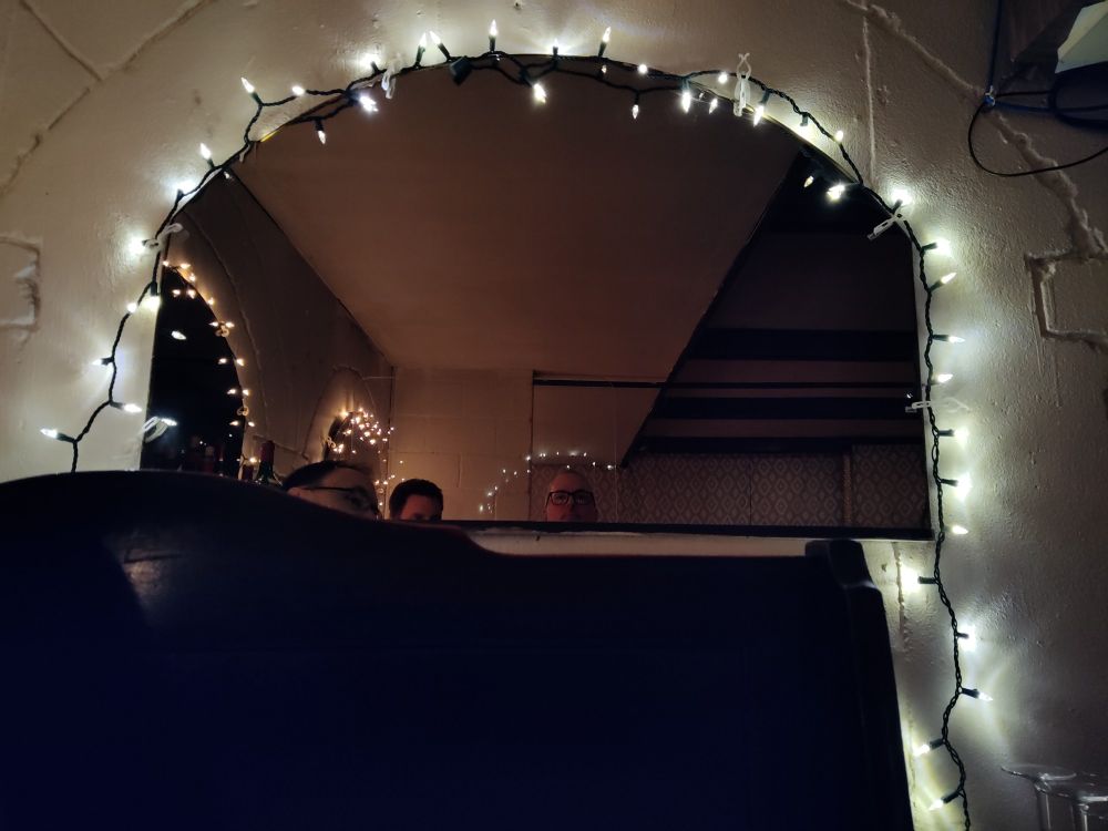 light strewn archway in a restaurant with halo over jeff's head