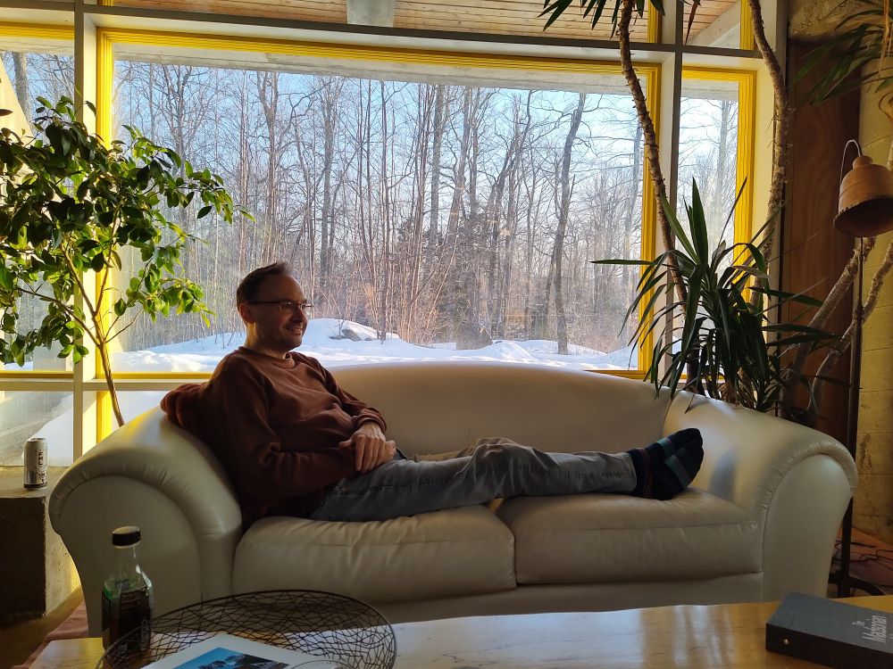 Matt Cheney reclining on couch