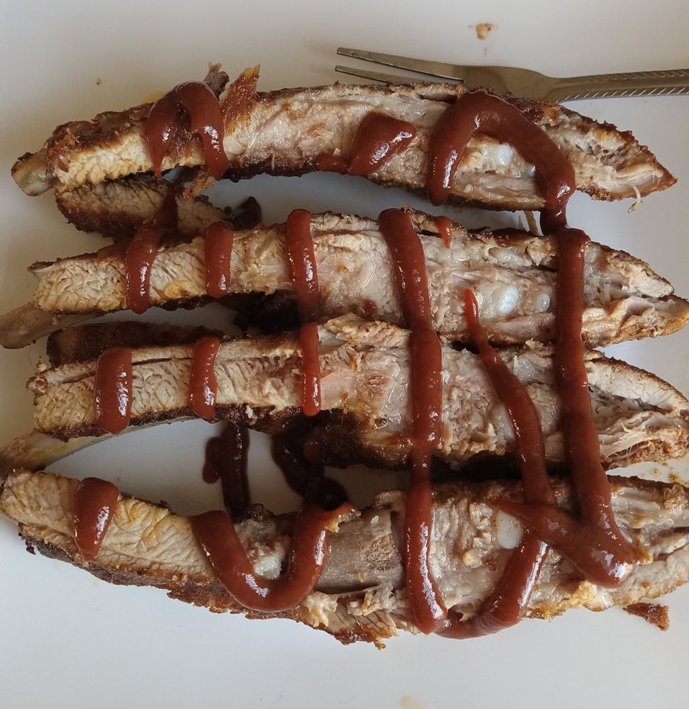 Sous vide pork spare ribs dry rub and Wright liquid hickory smoke added then cooked 24 hours at 145⁰F then roasted in a 350⁰ oven. Sweet Baby Ray's no sugar added sauce.