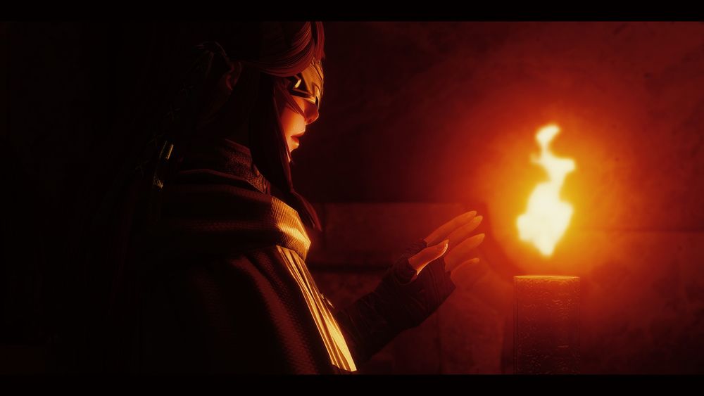 It's my Final Fantasy Tactics oc, Orpheus, dressed up as the Fire Keeper from Dark Souls. The photo is dark, there is a flame off to the left. Orpheus is on the right as she reaches out towards the flame.