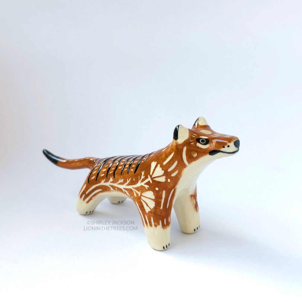 Sgraffito Thylacine ceramic sculpture. There are markings and my signature California Poppy motif carved all around its body.
