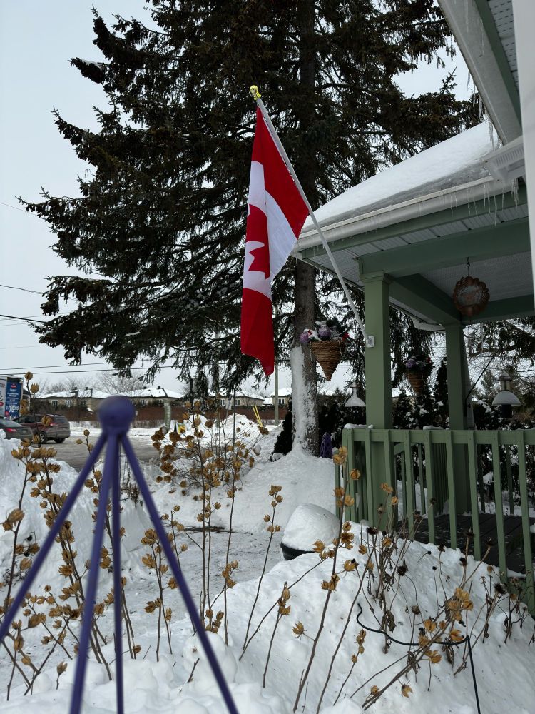 Canadian flag on a pole off our front porch
