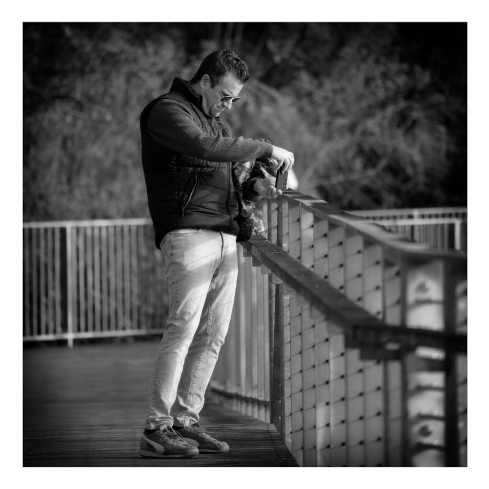 A man taking a pic with his phone