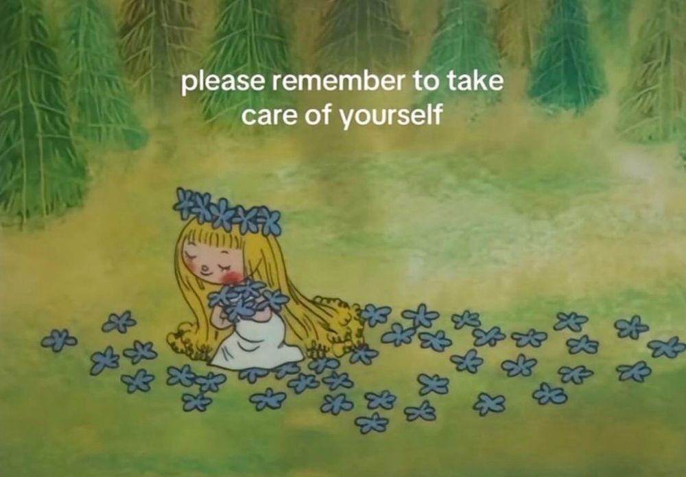 a blonde cartoon character wearing a white dress and a blue flower crown. she is picking blue flowers in a field. the text on the image reads: “please remember to take care of yourself”