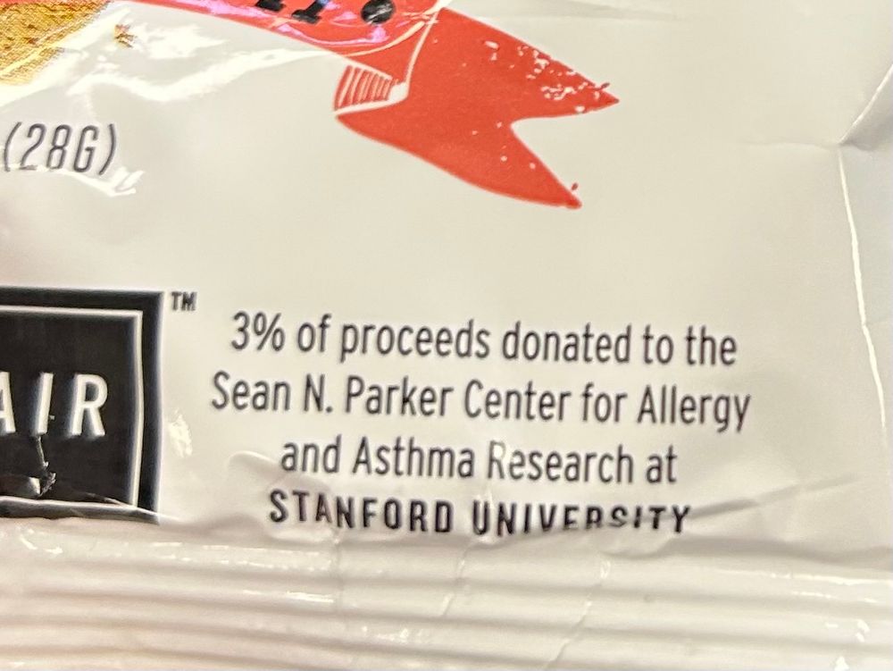 Snack package indicating 3% of proceeds donated to research 