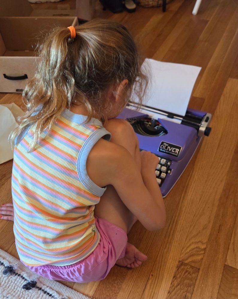 A young child composing the great American novel
