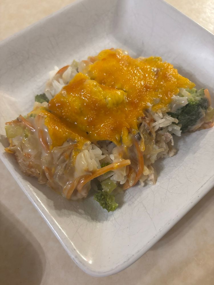 Casserole served on a white square plate. 