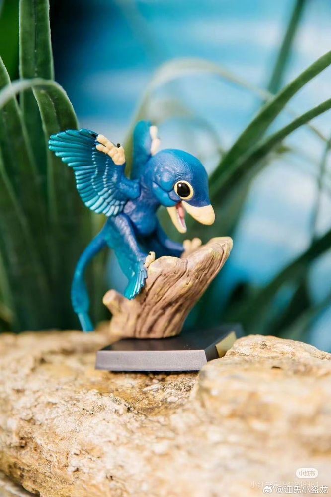 A tiny blue microraptor