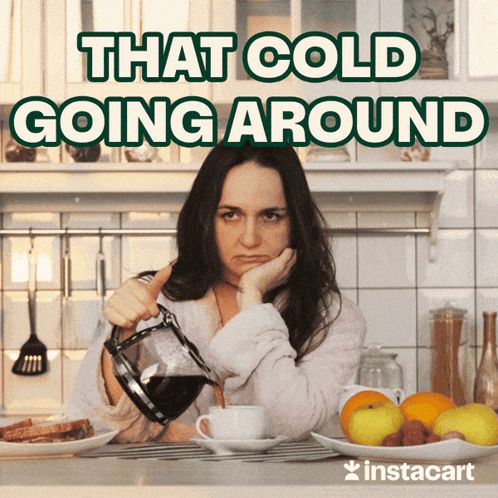 a woman in a bathrobe is pouring coffee into a cup with the caption " that cold going around "