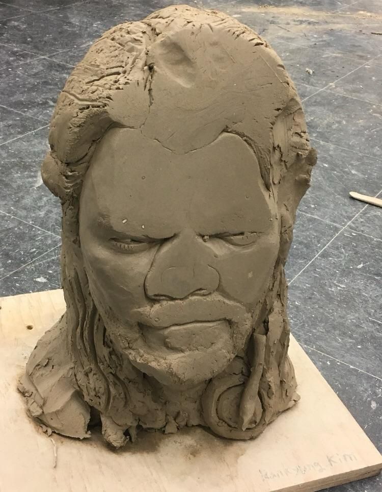 the smushface clay statue
