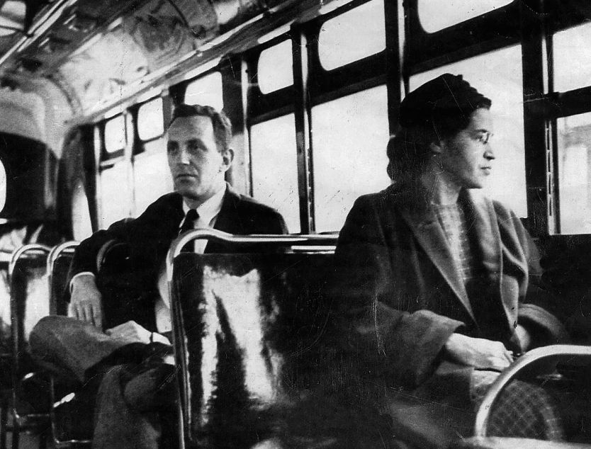 Rosa Parks sitting on the bus, refusing to give up her seat