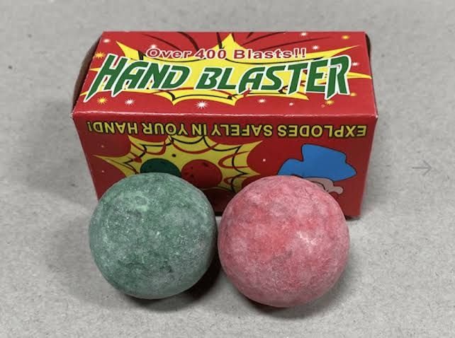 A pack of Hand Blaster Balls, two ceramic balls coated in a mixture that makes them strike sparks when struck together. Much like The Thing's palm likely does against his cock.