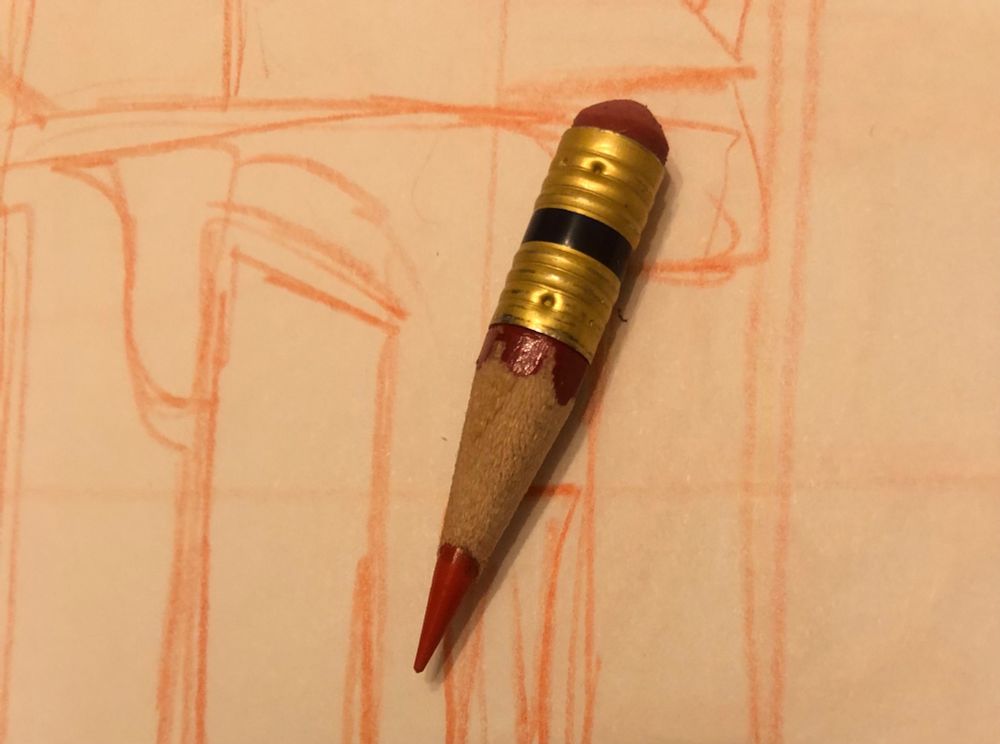 The merest stub of a red col-erase pencil