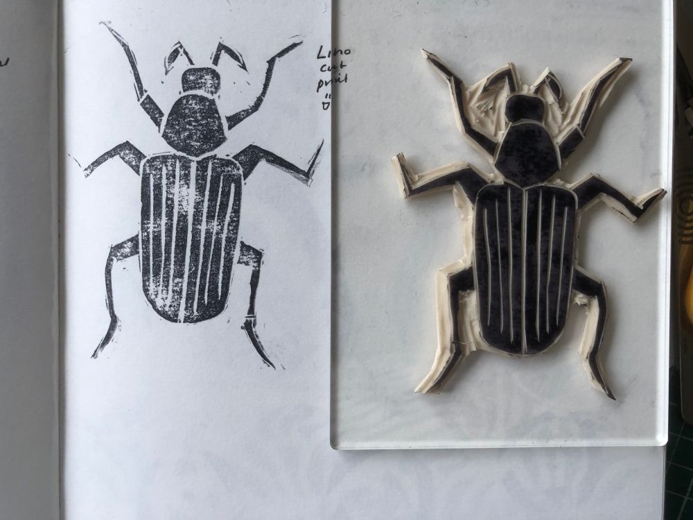 On the left, an image of a beetle in slightly patchy black ink. On the right, the stamp.