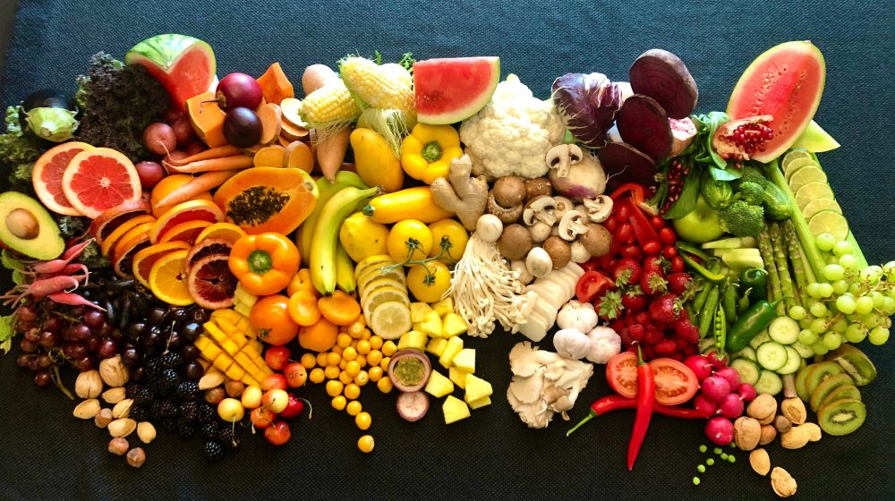 Image thanks to Jan Landau on Unsplash. The image shows a wide range of nuts, fresh fruit, vegetables, peas and mushrooms in bright colours against a dark background. 

The research considered seven food groups that are part of the WWF's Livewell diet.


