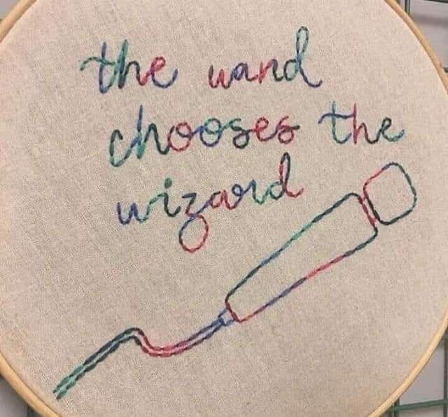 Needle point stitch of a vibrator, saying "the wand chooses the wizard" 