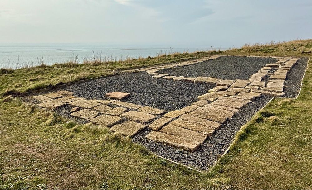 The foundation outline of a C7th church on the Heugh at Lindisfarne. 