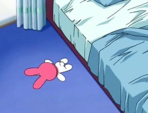 mymelody face down on the floor next to a bed