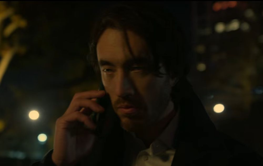 Character from the Netflix series Black Doves on a mobile phone