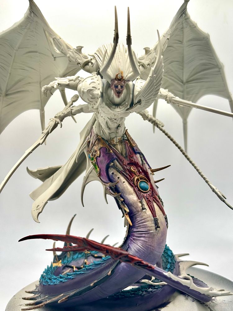 A partially painted Fulgrim. Using purples, teals and golds.  